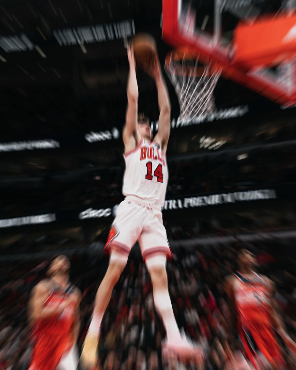a bulls dunk frozen mid-air while the arena streaks