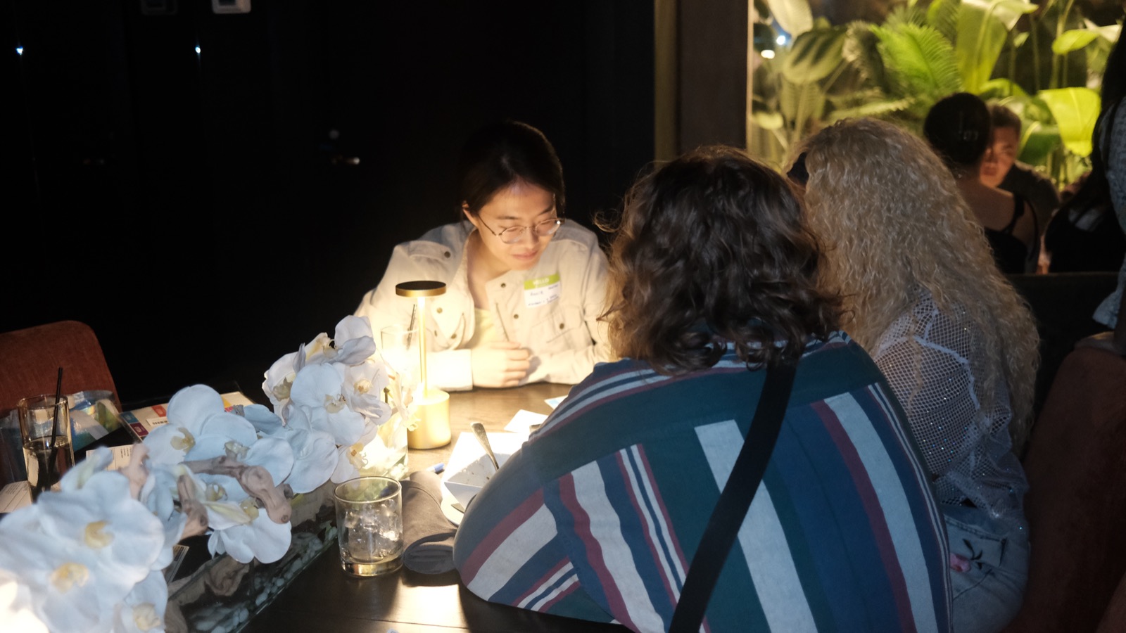two guests deep in candlelit conversation at a vol 2 table