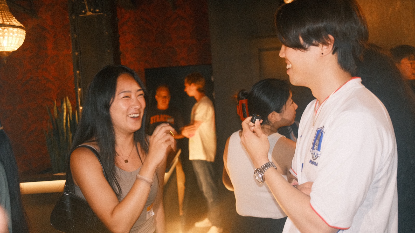 two people cracking up mid-conversation at vol 2
