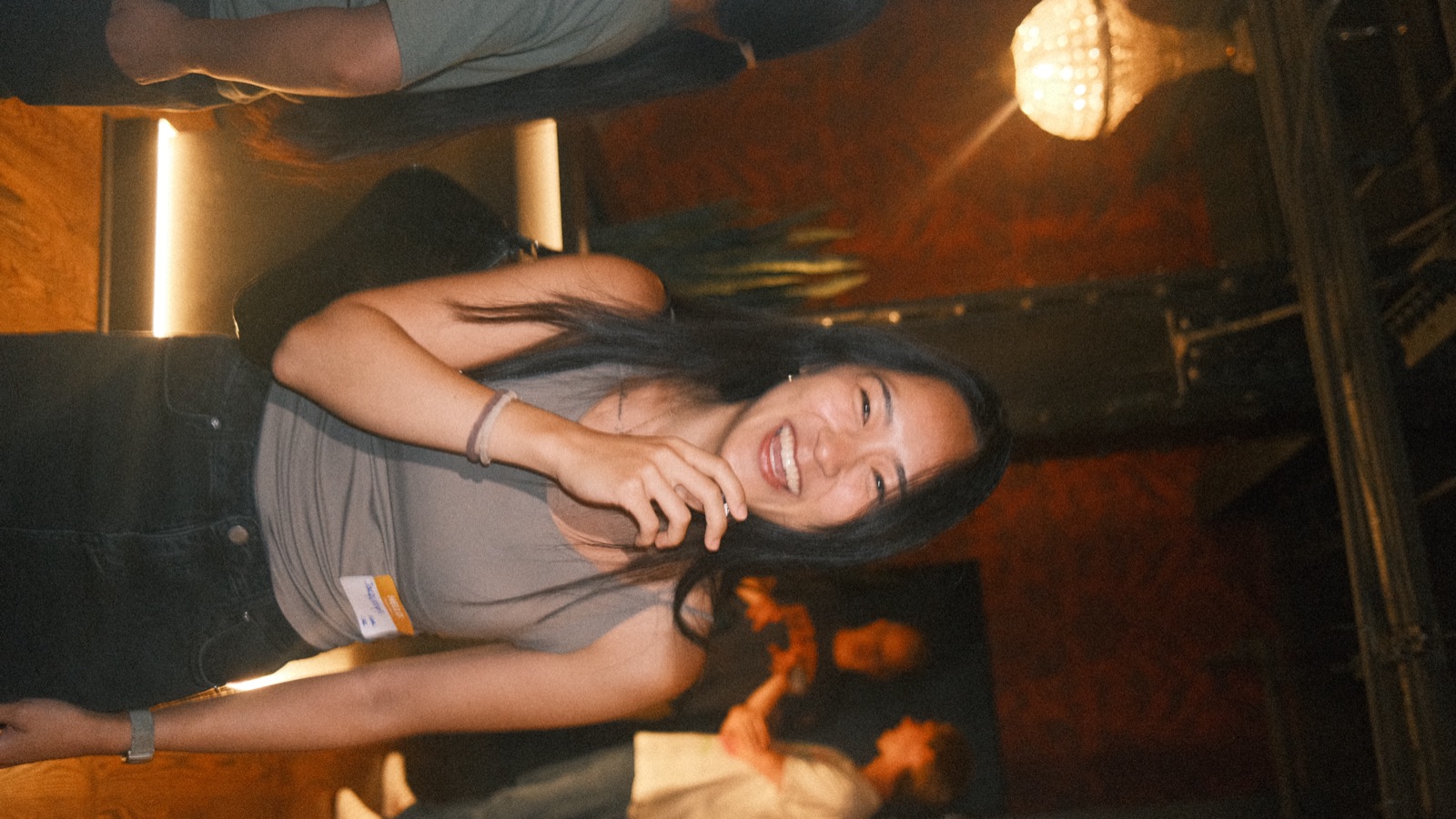 mid-laugh under the chandelier at vol 2