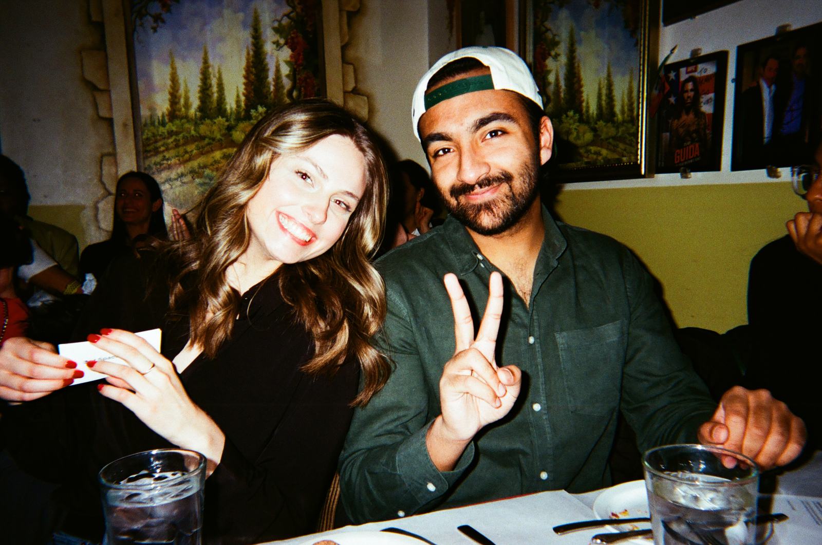 two members beaming at the holiday dinner table — experience 4